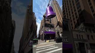 Download lagu A man rings a giant bell in the middle of city mp3