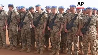 French and German FMs review troops