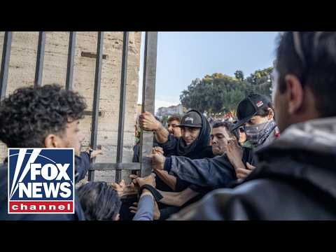Masked rioters STORM colosseum in Rome as violent unrest spreads