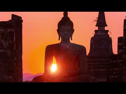 Fields of Passion: Radiant Sunset Behind Stone Buddha