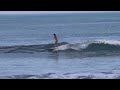 Girl Surfing In Bikini In Bali Indonesia