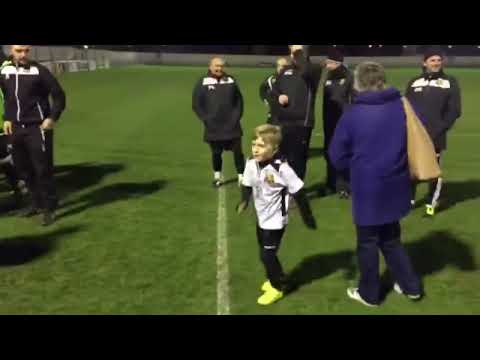 Hoddesdon Town lift the trophy after beating Welwyn Garden City 1-0