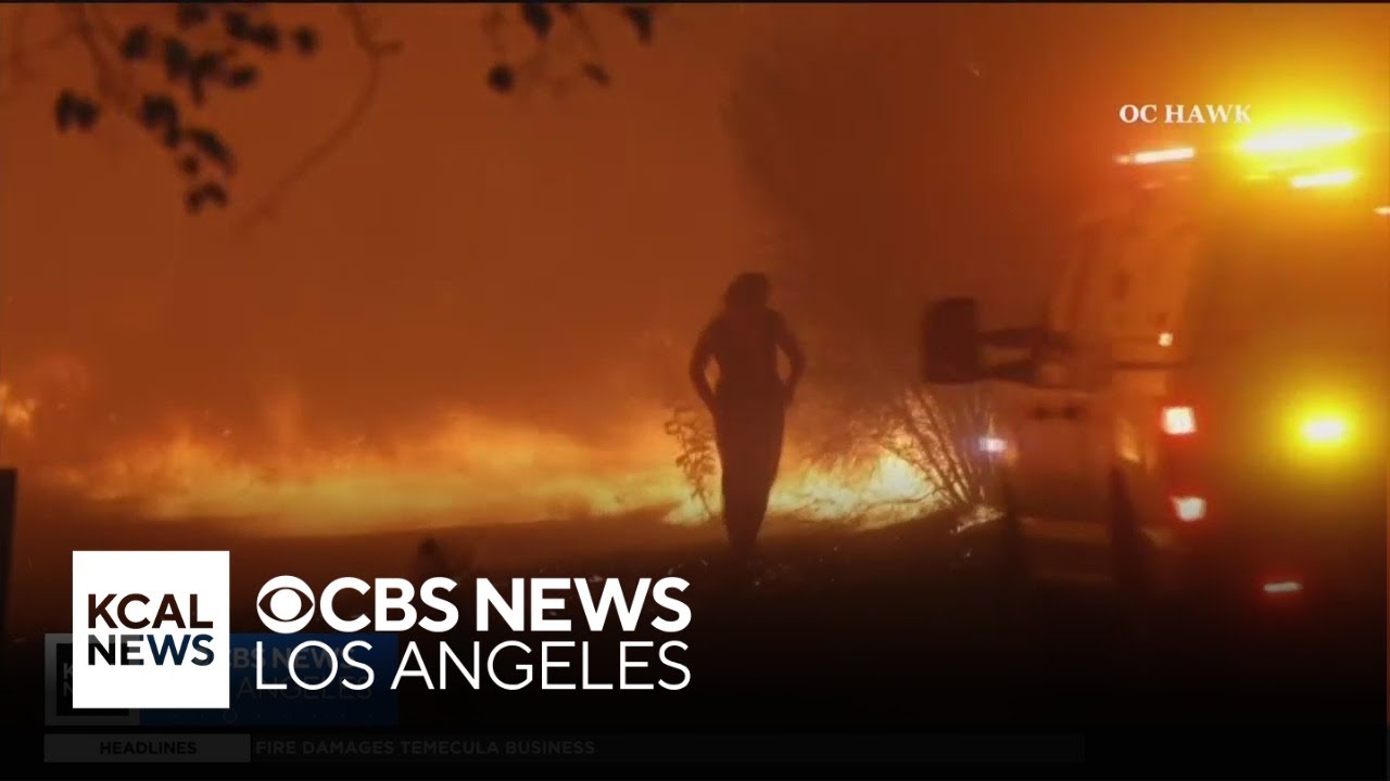 Battalion chief rescues a woman surrounded by flames during the Airport Fire