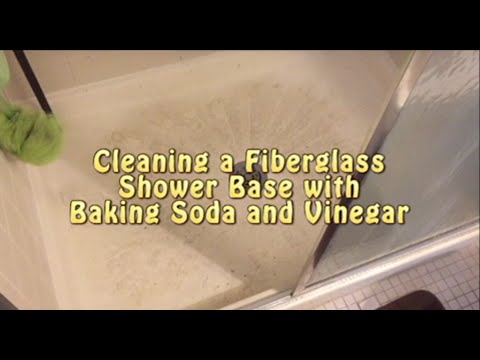 Cleaning shower base with baking soda and vinegar