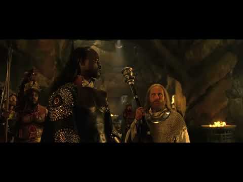 Trailer frame: close shot of Eragon drawing Brisingr; percussion tightens like a countdown