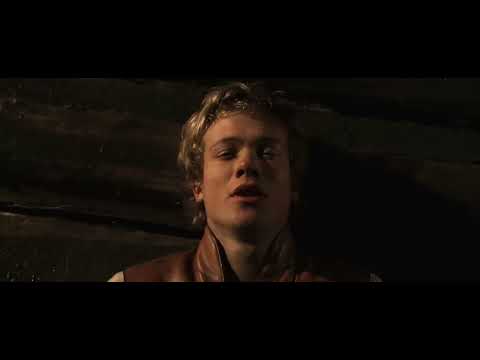Eragon official trailer frame with Eragon and Saphira against a storm-blue sky