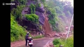 Landslide misses motorcyclist, makes you FEEL the rockfall