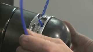DR Trimmer cord being inserted into Quick-Lock trimmer head