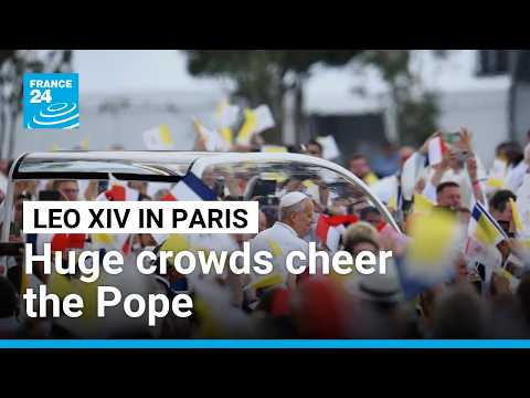Huge crowds cheer Pope Leo along Champs-Elysees ahead of Paris mass