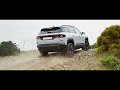 Jeep Compass 4xe navigating an off-road trail in Sardinia