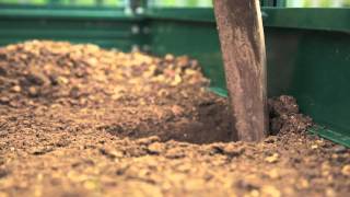 Harrod Horticultural Greenhouses - Installing ground anchors for greenhouse...