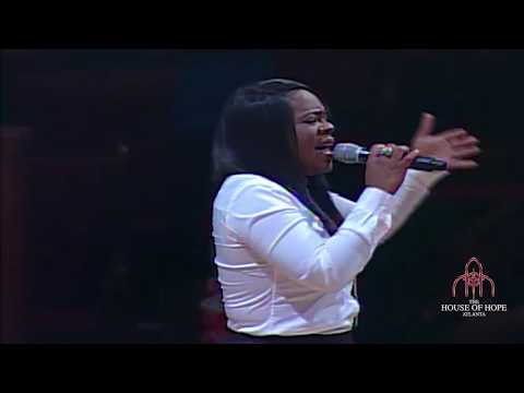 Rev. Jennifer Carner singing I told the Storm