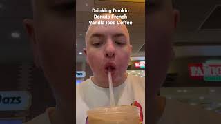 Drinking Dunkin Donuts French Vanilla Iced Coffee