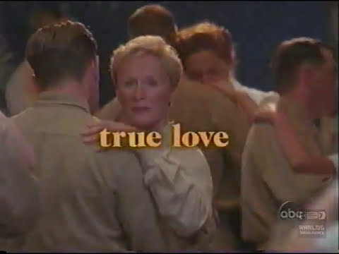 2001 ABC promo still: Glenn Close as Nellie Forbush on a sunlit beach, with WWII tents behind