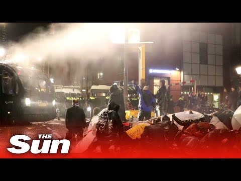 Dutch protesters blasted with water cannons by riot cops as lockdown returns