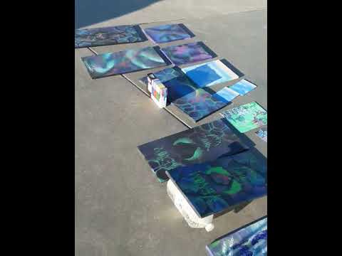 Car drives on Santa Monica bike path by homeless artist Paul Painter's DIY street art lab LA Cali