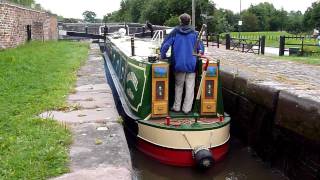 preview picture of video 'English Canal Narrowboat going through a Lock in Stone Staffordshire August 2010 by Workhouse Bridge'
