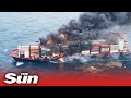 Explosion on burning container ship carrying Nitric Acid injures 2