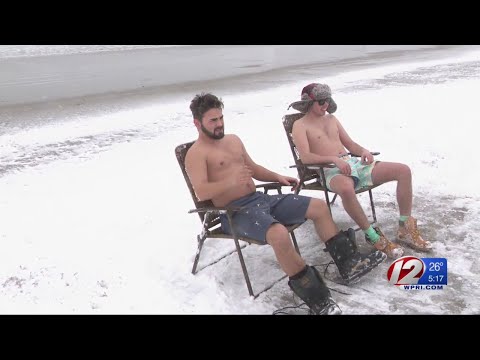 Surfers brave the elements during winter storm