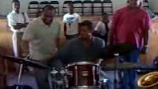 Alvin Atkinson, Jr, teaching street kid Raphael to play drumset for first time