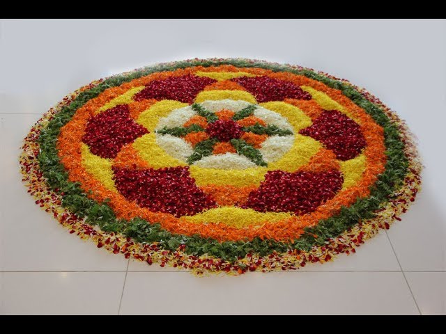 Big onam flower rangoli design with fragrant flowers