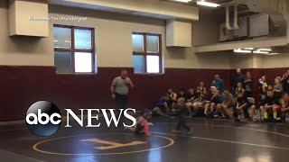 Little brother mistakes his sister's wrestling match for a real fight