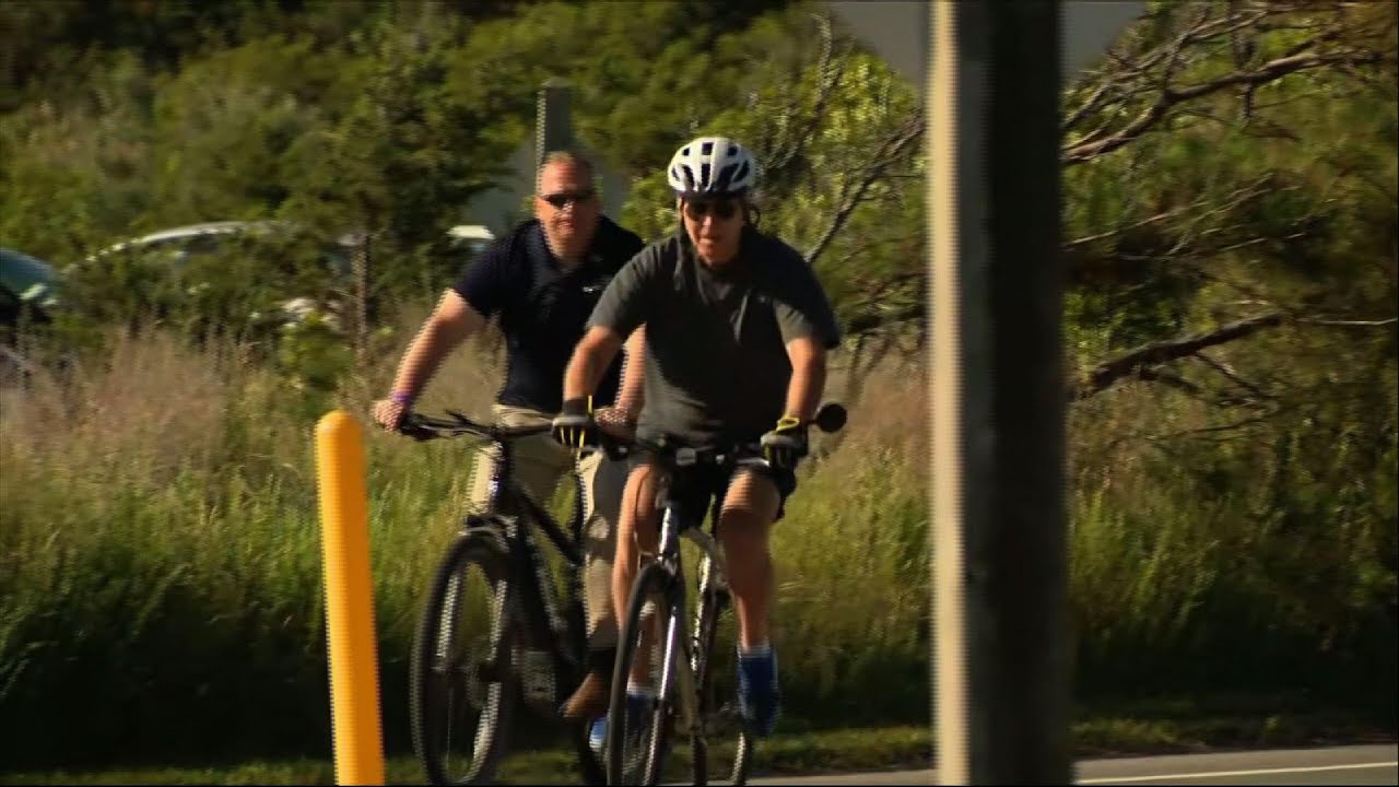 Biden tumbles getting off bike after beach ride