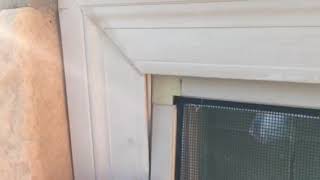 How to put a window screen back in place.