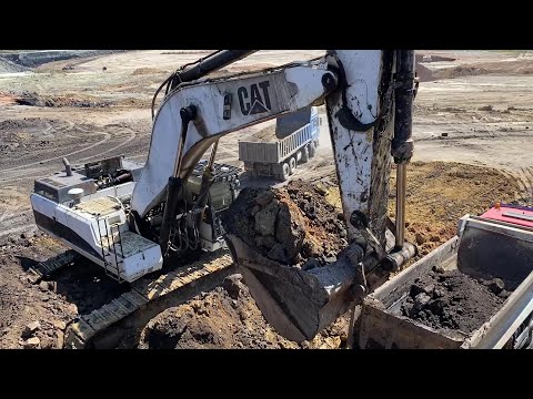 Caterpillar 375 Excavator Loading Mercedes & MAN Trucks