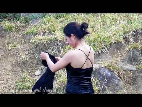 Hmong girl goes to the garden to cut koi leaves