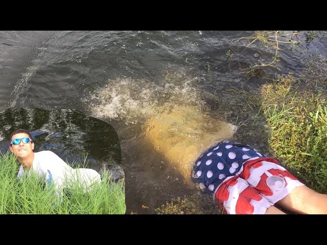 HAND FISHING DEEP UNDERWATER HOLES FOR CATFISH