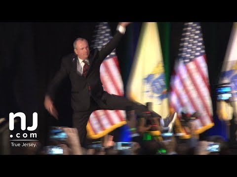 Phil Murphy leaps onto the stage for victory speech