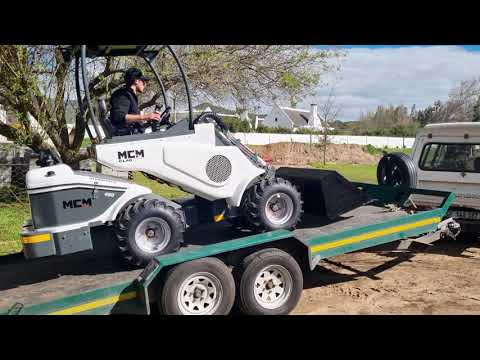 Loading CL40 Compact Loader Onto Client's Trailer
