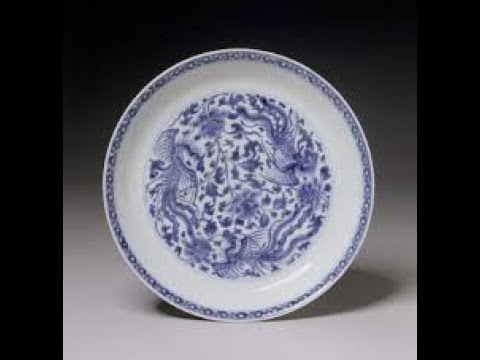 "IDOL"An ink dot on a white porcelain dish appears dark. When the dish is raised ....
