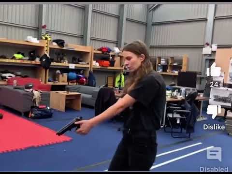 Eliot Sumner with a gun