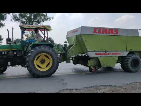 I spotted Old John Deere and Claas Quadrant 1200 Baler on Highway 🛣️