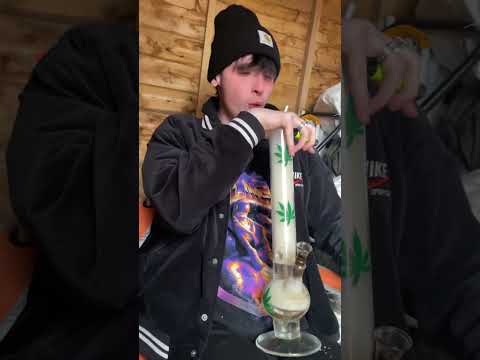 man rips a bong and coughs his lungs out