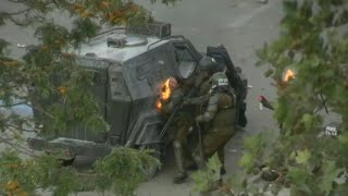 Download lagu Riot police officer hit by molotov cocktail during Chile protests | AFP mp3