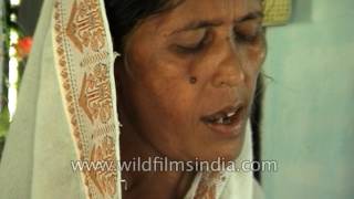 Leprosy afflicted villagers in Assam, with church collection for patients