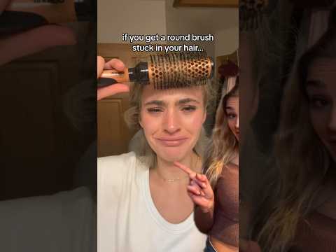 Part of a video titled round brush stuck in your hair? look no further. #shorts #hair ... - YouTube