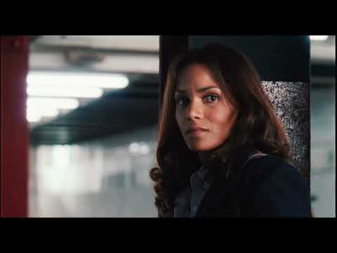 Trailer close-up of Halle Berry at a monitor; reviews slammed the plot but acknowledged its slick, tech-noir vibe
