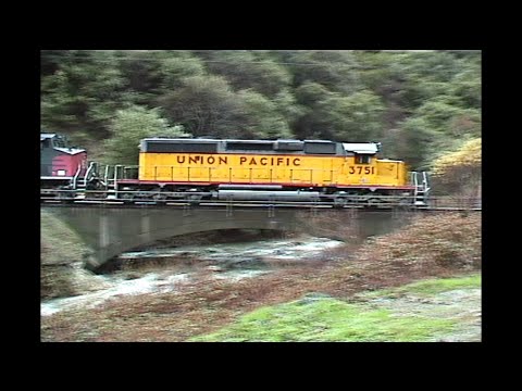 1216. UNION PACIFIC UP 3751 on the Feather River route by tunnels  on Februrary 12 2000 with 3 freig