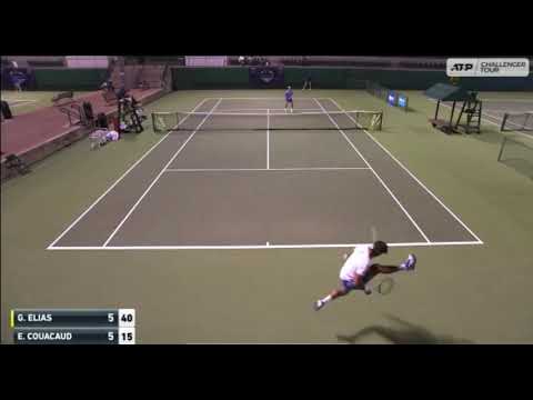 Gastão Elias hits a tweener passing shot against Enzo Couacaud in Waco Challenger