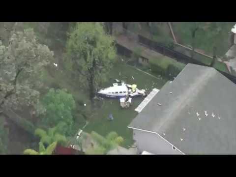 Five people died and two others were injured after a small plane apparently came apart, raining debris across a Southern California neighborhood and igniting a house fire before landing in a backyard, authorities said Sunday. (Feb. 4)