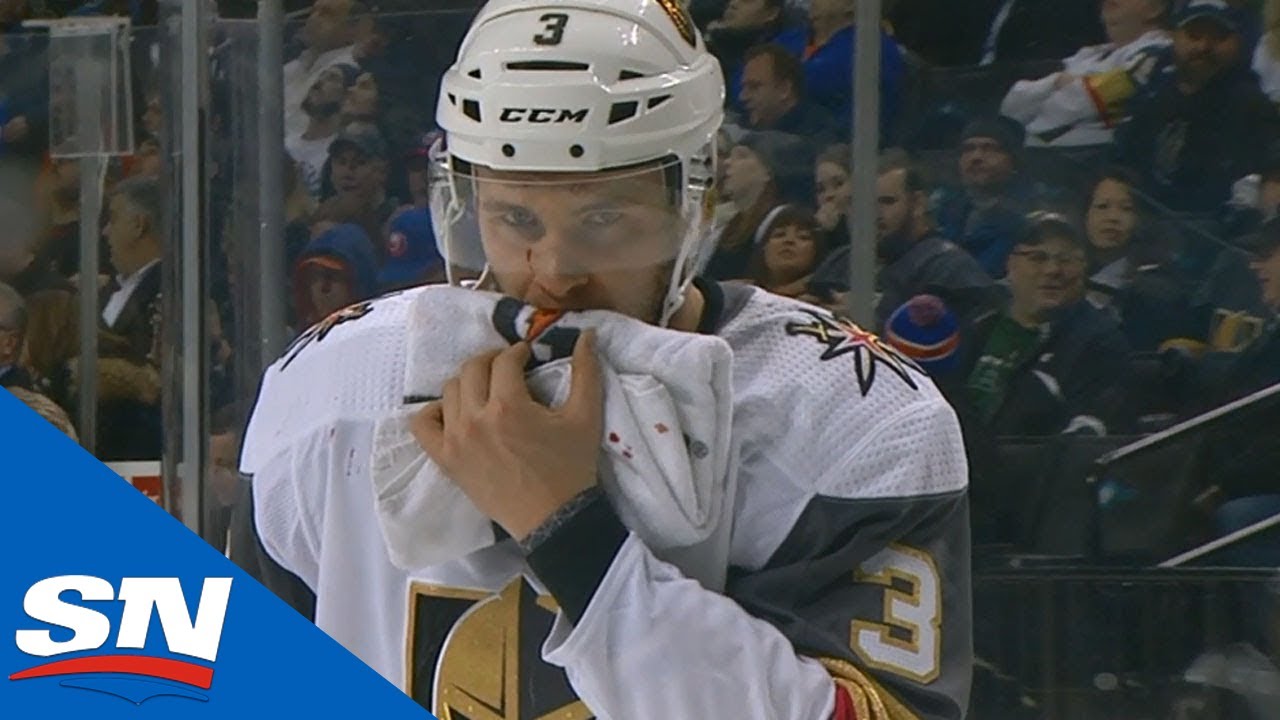 Vidéo: Le gars reçoit une PUCK en PLEINE FACE!!!!! Sur le banc...