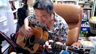 MOMENTUM Aimee Mann Magnolia sing with guitar