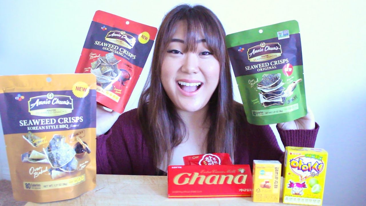 Packets of Korean seaweed snacks from popular brands like Bibigo and Yangban arranged for a taste test review on camera