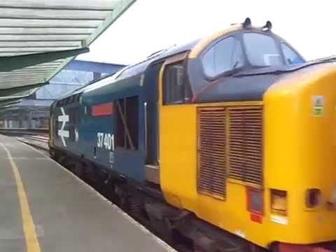 The Class 37 BR Large Logo Blue No.37401 with ‘Northern Cumbrian Coast Train’ departs at Carlisle.