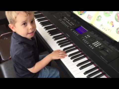 Our 4 year-old ready for piano lessons at Yamaha Music...