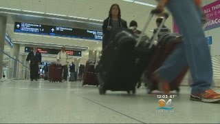 Hundreds Of Flights Cancelled In Blizzard Aftermath